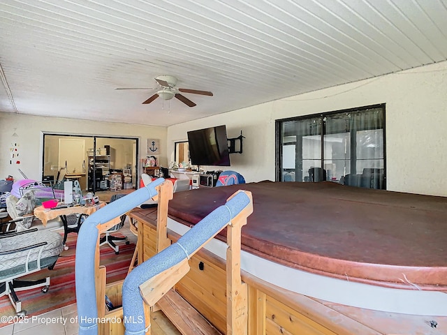 interior space featuring ceiling fan and a jacuzzi