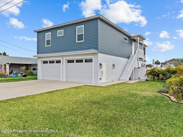 view of home's exterior featuring a garage and a yard