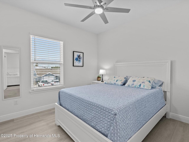 bedroom with ceiling fan and light hardwood / wood-style floors