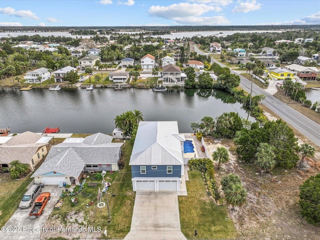 birds eye view of property featuring a water view