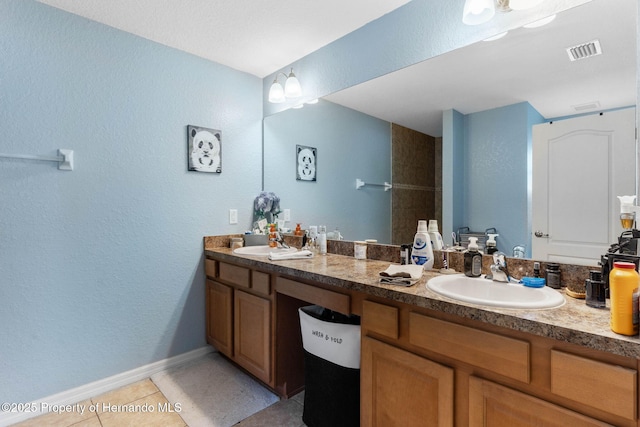 bathroom featuring vanity and tile patterned flooring