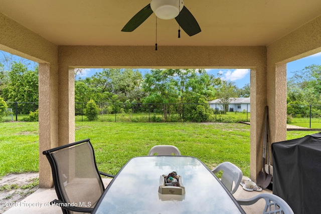 view of patio featuring a grill and ceiling fan