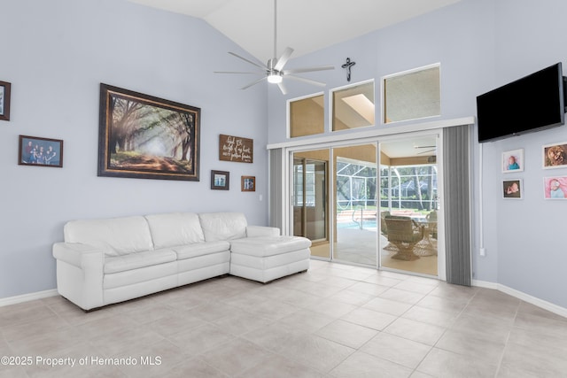 unfurnished living room featuring high vaulted ceiling, light tile patterned floors, and ceiling fan