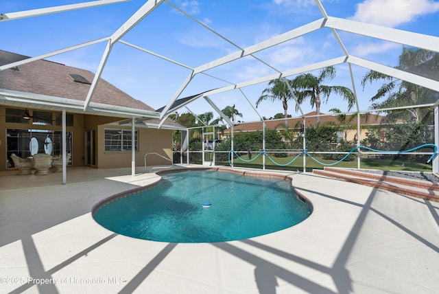 view of pool featuring a lanai and a patio area