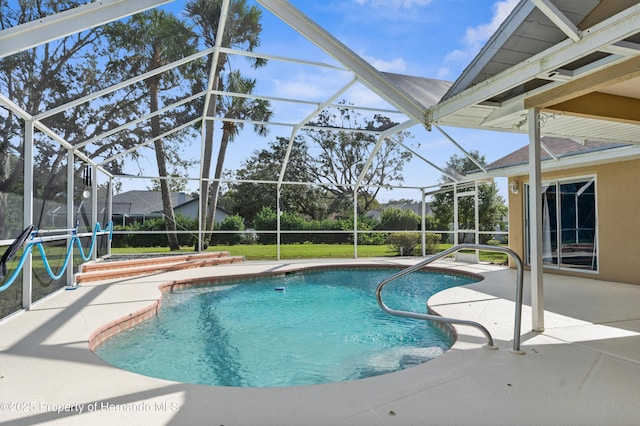 view of swimming pool featuring a lanai and a patio area