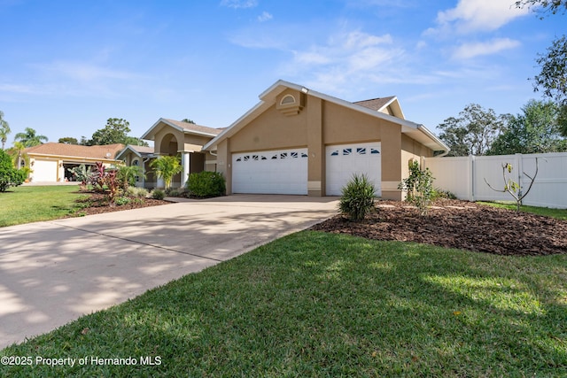 view of front of home with a garage and a front lawn