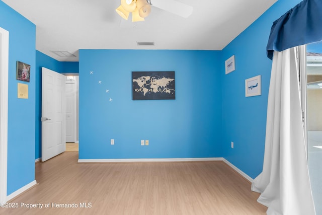 unfurnished bedroom featuring ceiling fan and wood-type flooring