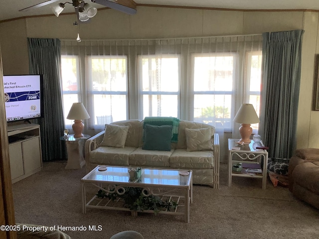 living room featuring ceiling fan, a healthy amount of sunlight, and carpet