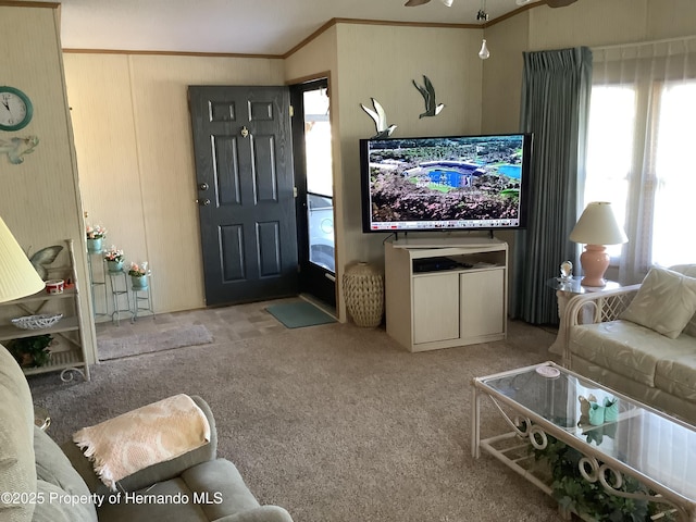 living room with crown molding and light carpet