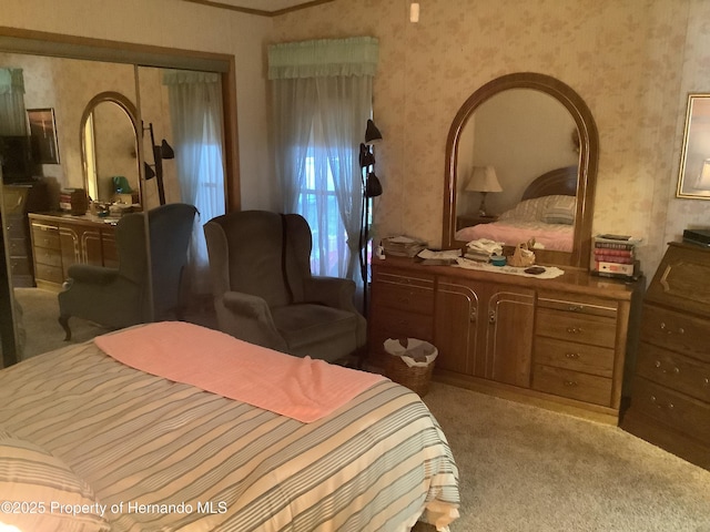 bedroom featuring carpet flooring and a closet