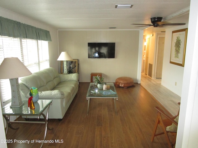 living room with ceiling fan, crown molding, and hardwood / wood-style floors