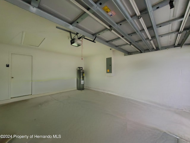 garage featuring electric water heater, a garage door opener, and electric panel