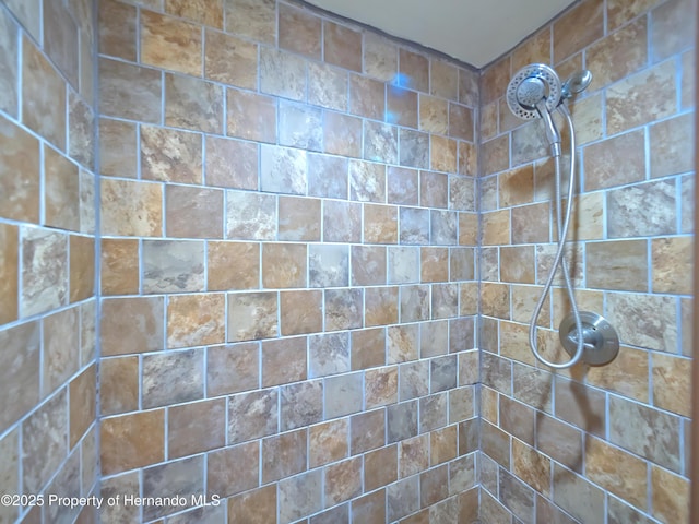 bathroom featuring tiled shower