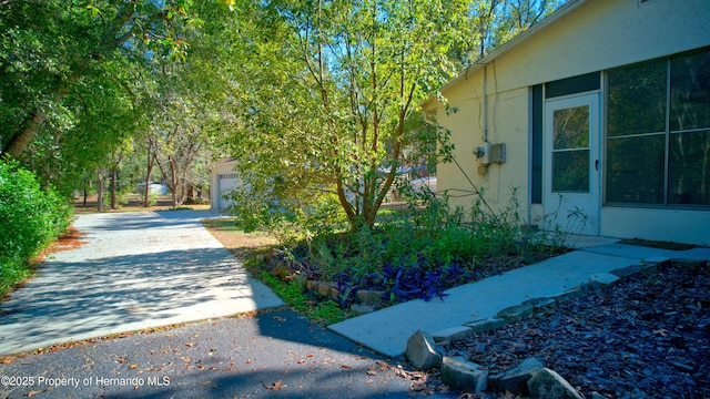 view of side of home featuring a garage