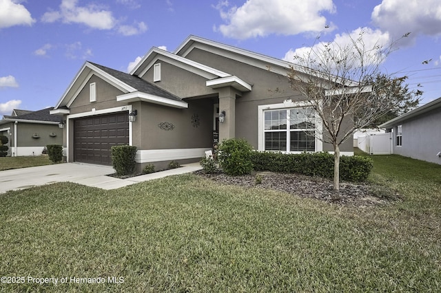 view of front facade with a garage and a front lawn