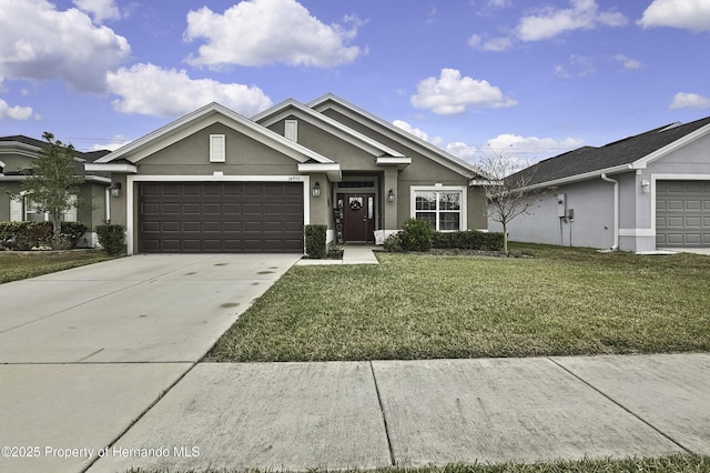 view of front facade with a garage and a front yard