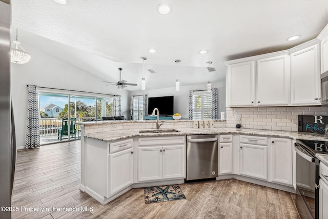 kitchen featuring dishwasher, hanging light fixtures, electric range, white cabinets, and kitchen peninsula