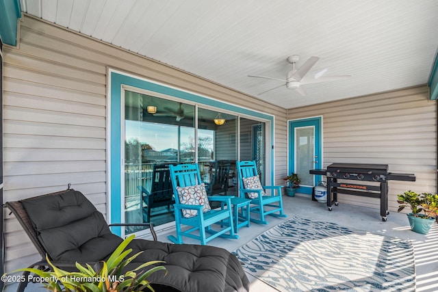 view of patio featuring area for grilling and ceiling fan