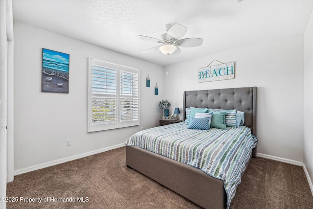 bedroom with ceiling fan, a textured ceiling, and carpet flooring