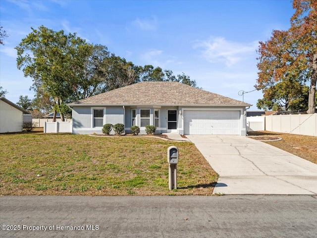 ranch-style house with a garage and a front lawn