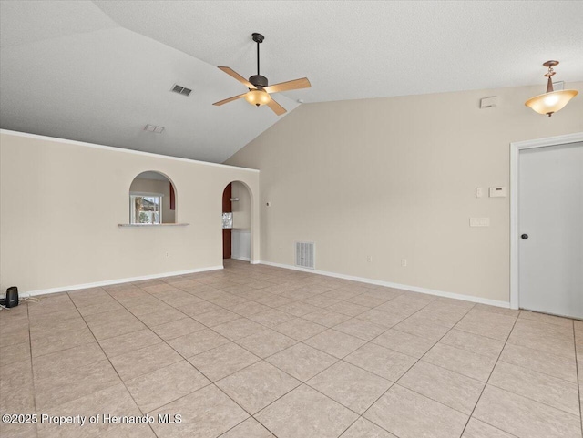 unfurnished room with ceiling fan, a textured ceiling, light tile patterned floors, and lofted ceiling