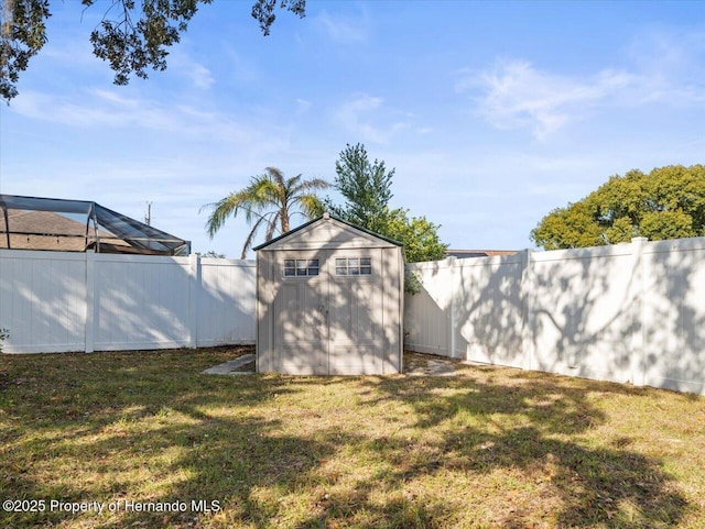 view of yard featuring a storage unit