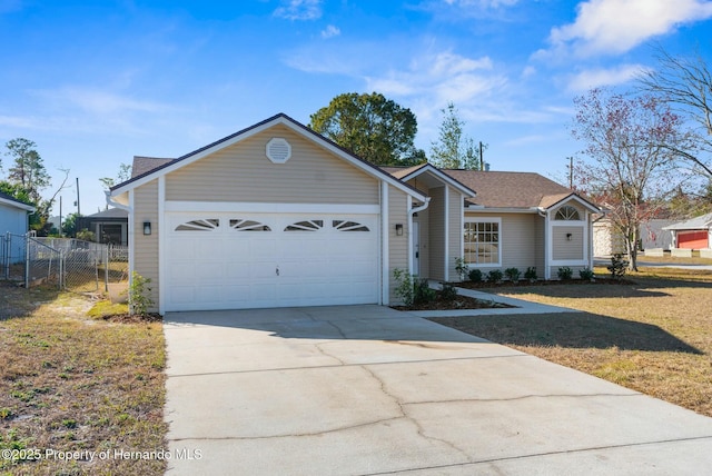 single story home featuring a garage and a front yard