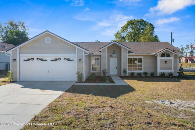 single story home with a garage and a front lawn