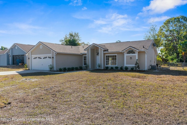 ranch-style house with a front lawn and a garage