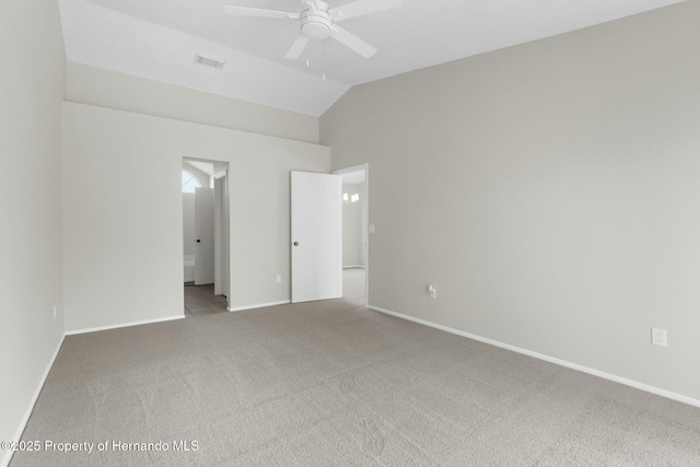 unfurnished bedroom with ceiling fan, carpet, and lofted ceiling