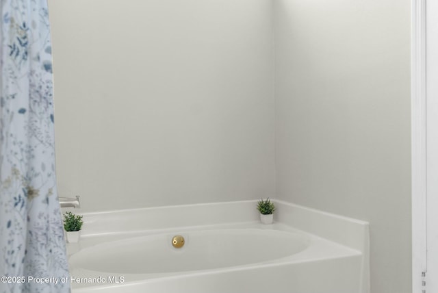 bathroom featuring a tub to relax in