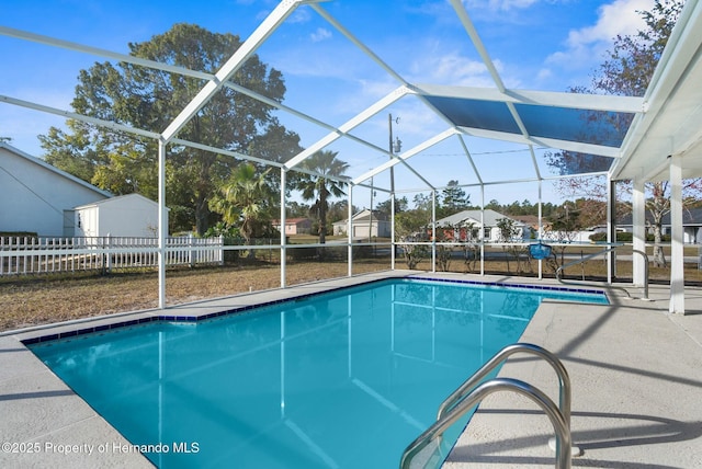 view of pool featuring a patio and glass enclosure