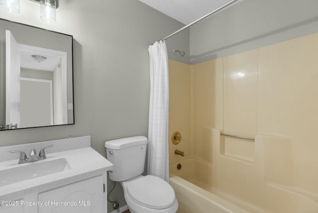 full bathroom with toilet, shower / tub combo, vanity, and a textured ceiling