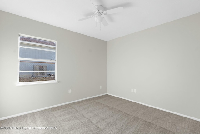 unfurnished room featuring ceiling fan and light carpet