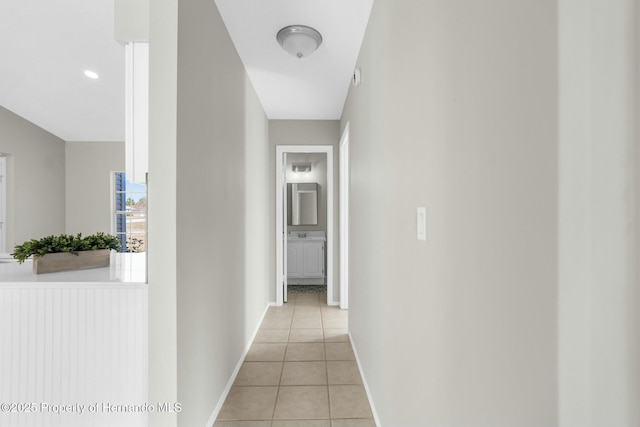 hall with light tile patterned floors