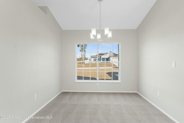 unfurnished dining area featuring light colored carpet and an inviting chandelier