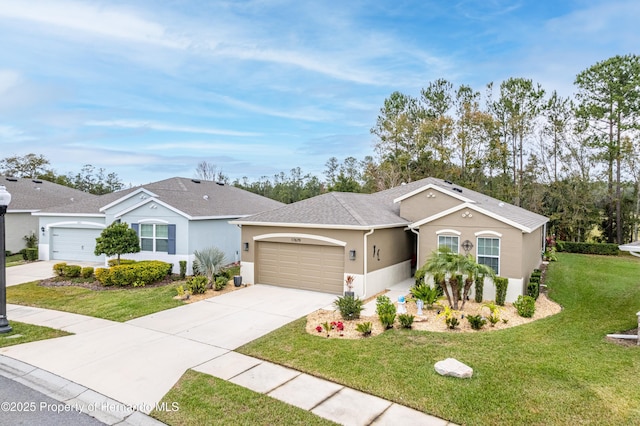 single story home featuring a garage and a front lawn