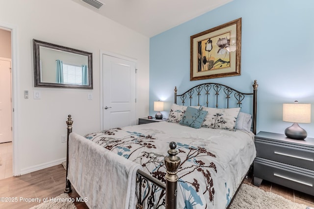 bedroom featuring hardwood / wood-style flooring