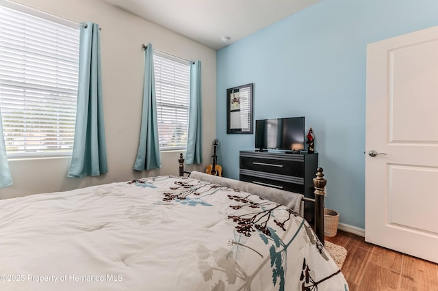 bedroom with light wood-type flooring