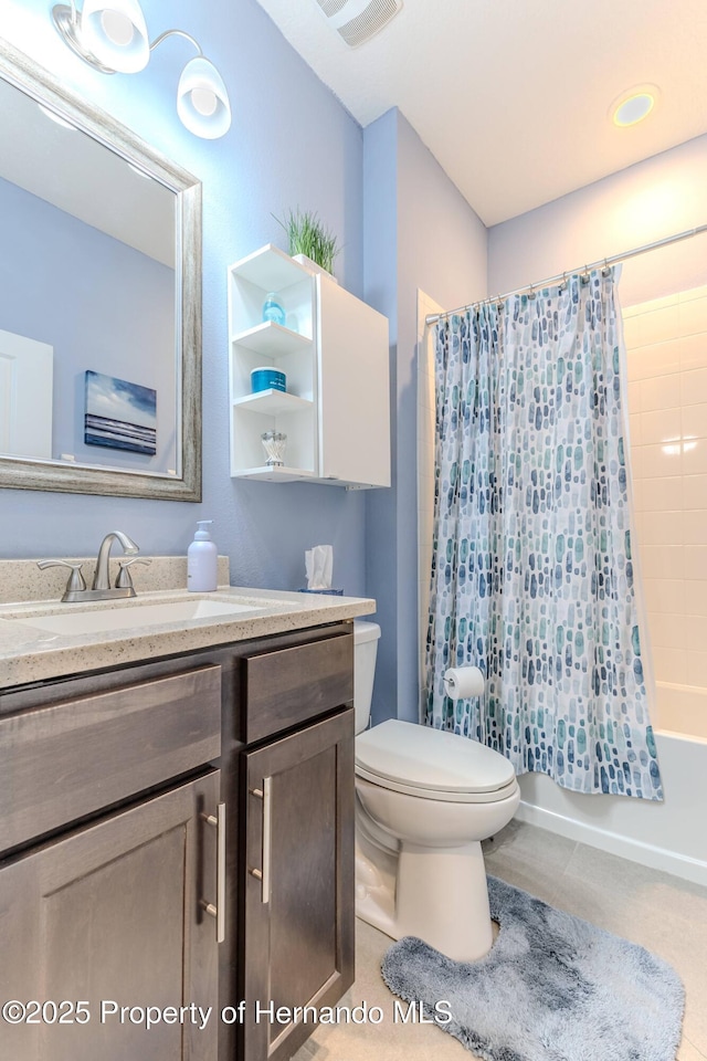 full bathroom featuring vanity, shower / bath combination with curtain, and toilet