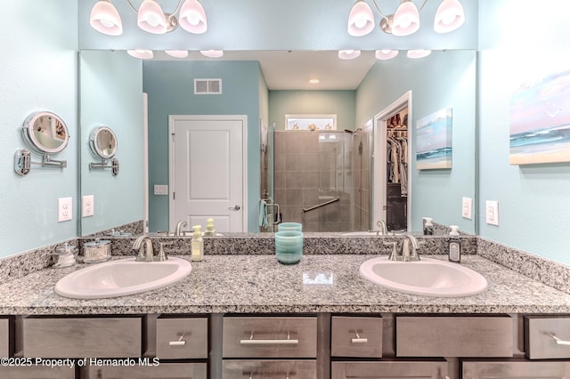 bathroom with vanity and an enclosed shower