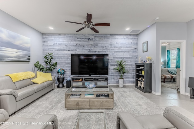 living room with wooden walls and ceiling fan