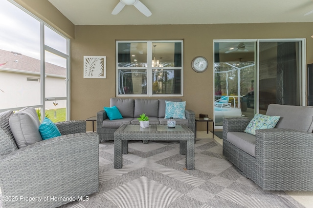 sunroom with ceiling fan