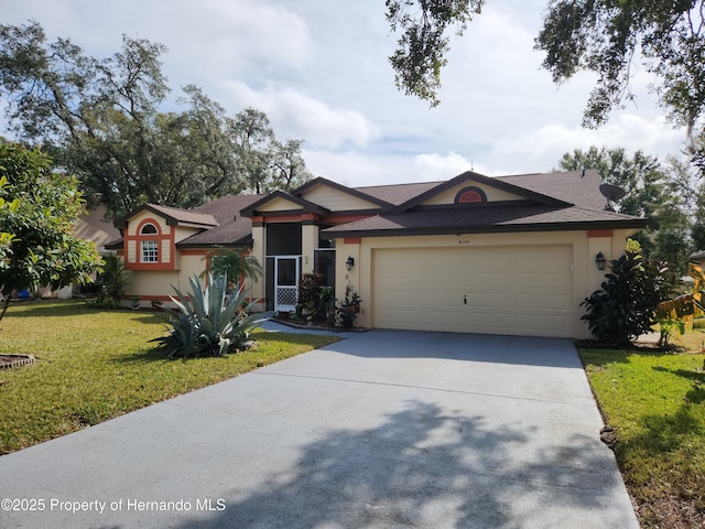 single story home featuring a garage and a front yard