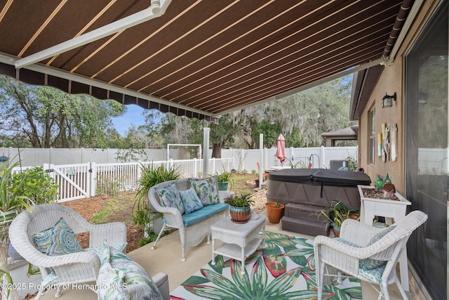 view of patio / terrace featuring a hot tub and outdoor lounge area