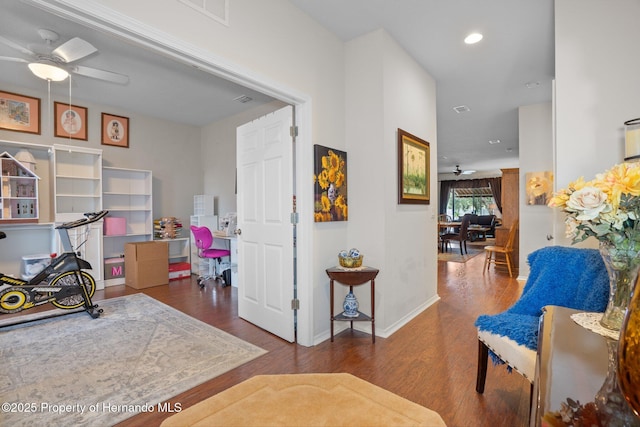 interior space with dark hardwood / wood-style floors and ceiling fan