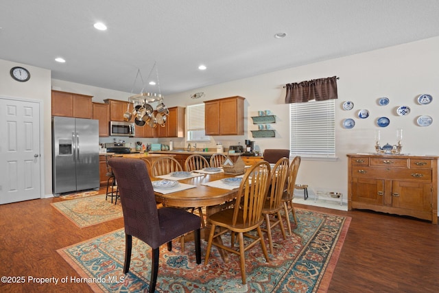 dining space featuring dark hardwood / wood-style floors