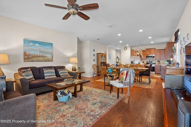 living room featuring hardwood / wood-style flooring and ceiling fan