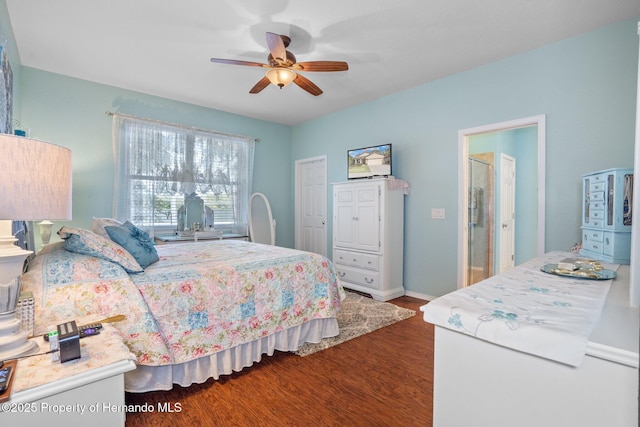 bedroom with ceiling fan and dark hardwood / wood-style flooring