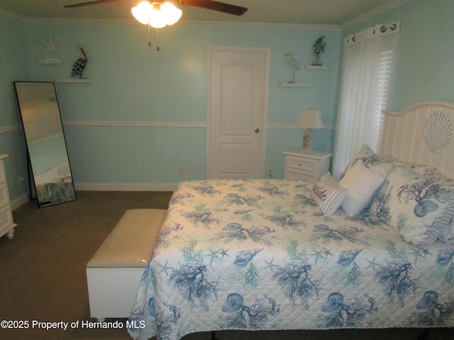 carpeted bedroom featuring crown molding and ceiling fan